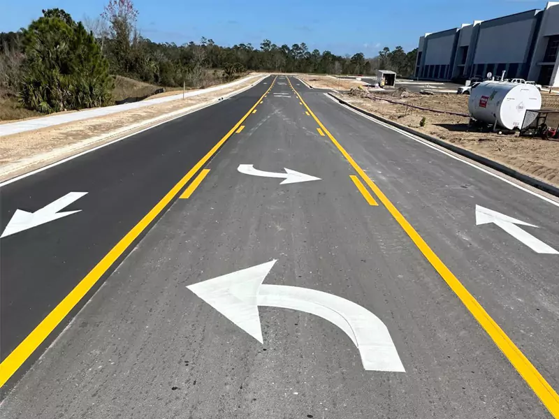 Fresh roadway pavement markings representing thermoplastic service